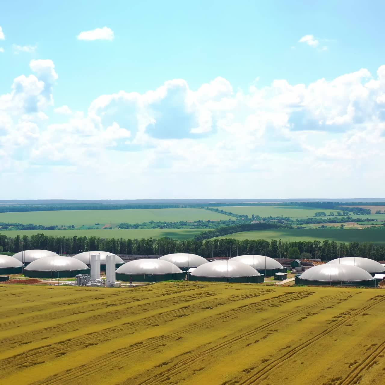 Modern agriculture complex on field. Biogas plant from the air perspective taken with a drone