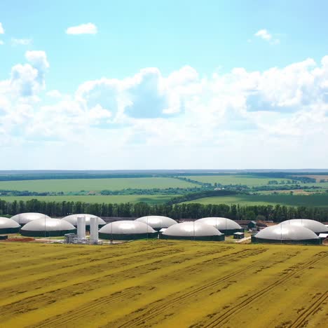 modern agriculture complex on field. biogas plant from the air perspective taken with a drone