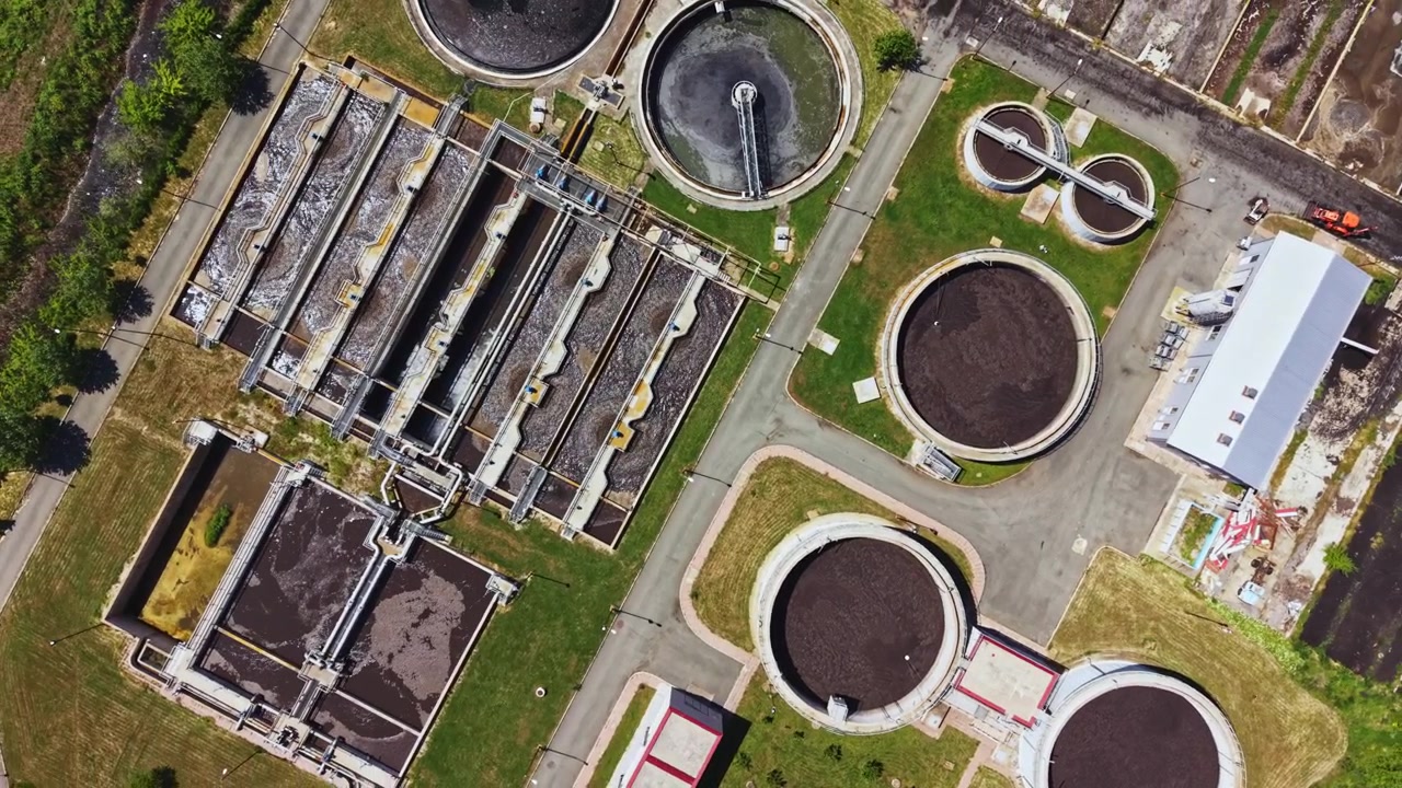 Aerial overview of treatment facility components. Unmanned aerial vehicle imagery providing detailed view of wastewater treatment infrastructure components and upgrades