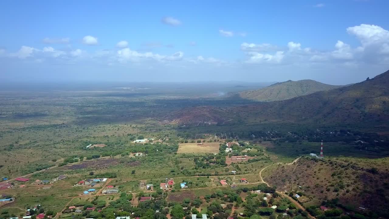 Aerial View Of Mount Moroto Rising On The Rural Town In Uganda, Africa.