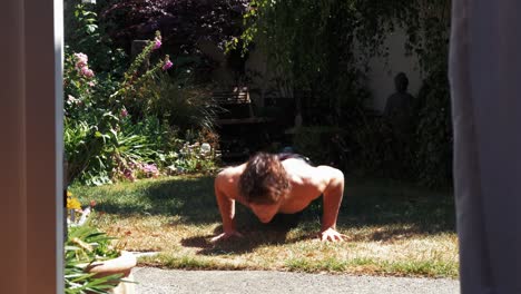 backyard workout young man doing push ups