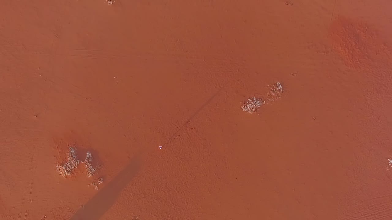 A man walks in the Desert from above in Riyadh Saudi Arabia