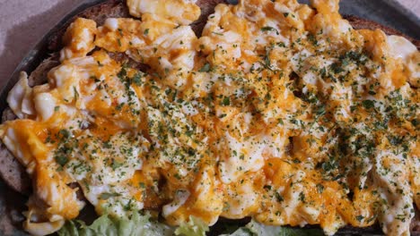scrambled eggs on toast with herbs