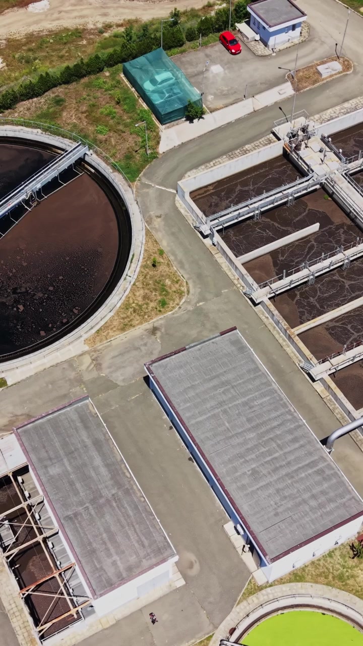 Water treatment facility shows tanks and equipment for processing water
