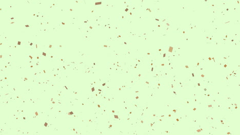 animación de confeti dorado sobre un fondo verde