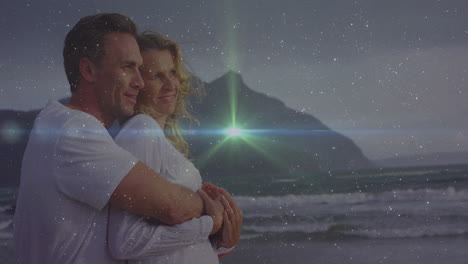 couple embracing on sandy beach at dusk, showcasing technology with star field and green lens flare