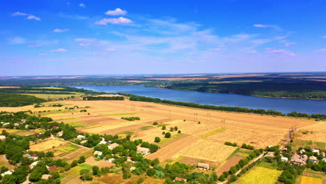 amazing scenery of picturesque landscapes on clear sunny day. yellow wheat fields near the river. wonderful nature of ukraine.