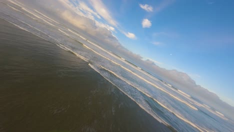 sunrise fpv drone shot near the beach of