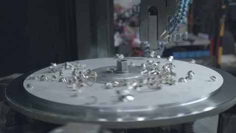 Closeup-shot-of-a-metal-milling-machine-carving-a-steel-disk-with-metal-fragments-scattering