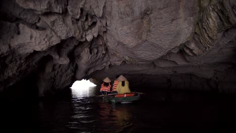 boat cave tour in ha long bay, vietnam