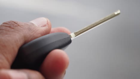 hand holding a car key
