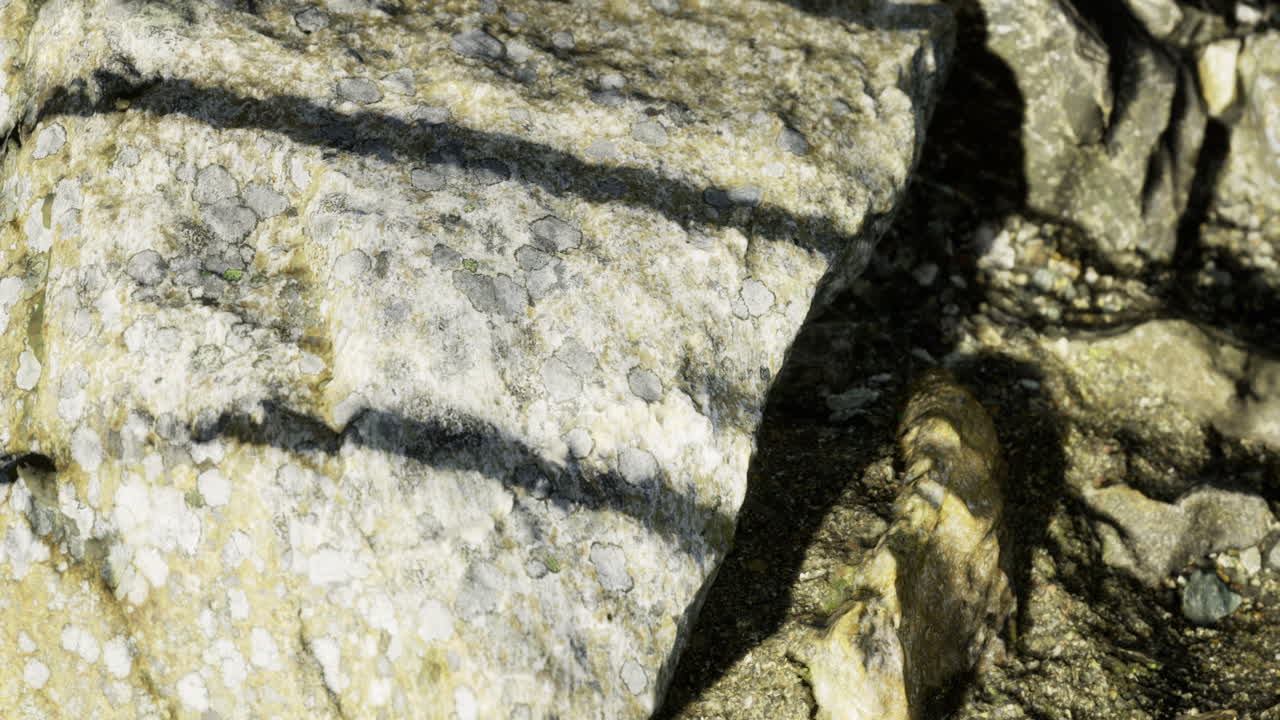 Exploring the textures and shadows of rugged rock formations in nature