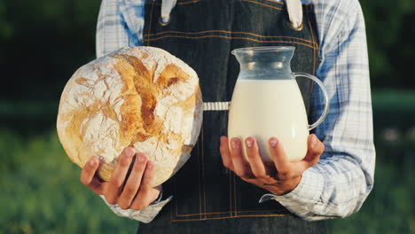 A-Farmer-Holds-A-Jug-Of-Milk-And-A-Loba-Loaf-Healthy-Organic-Food