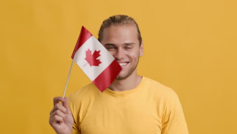 man holding canadian flag