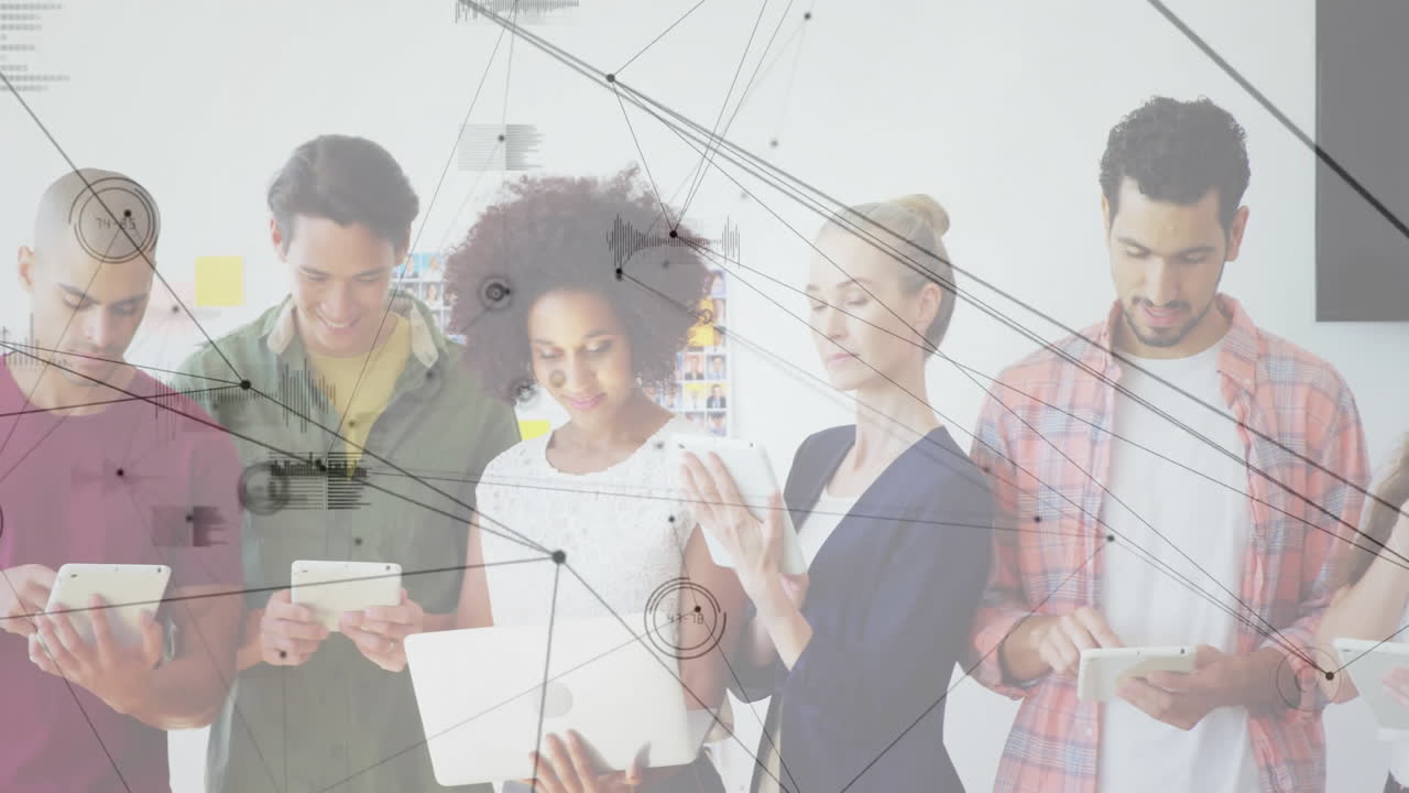 Using tablets, diverse group exploring digital network animation in school setting