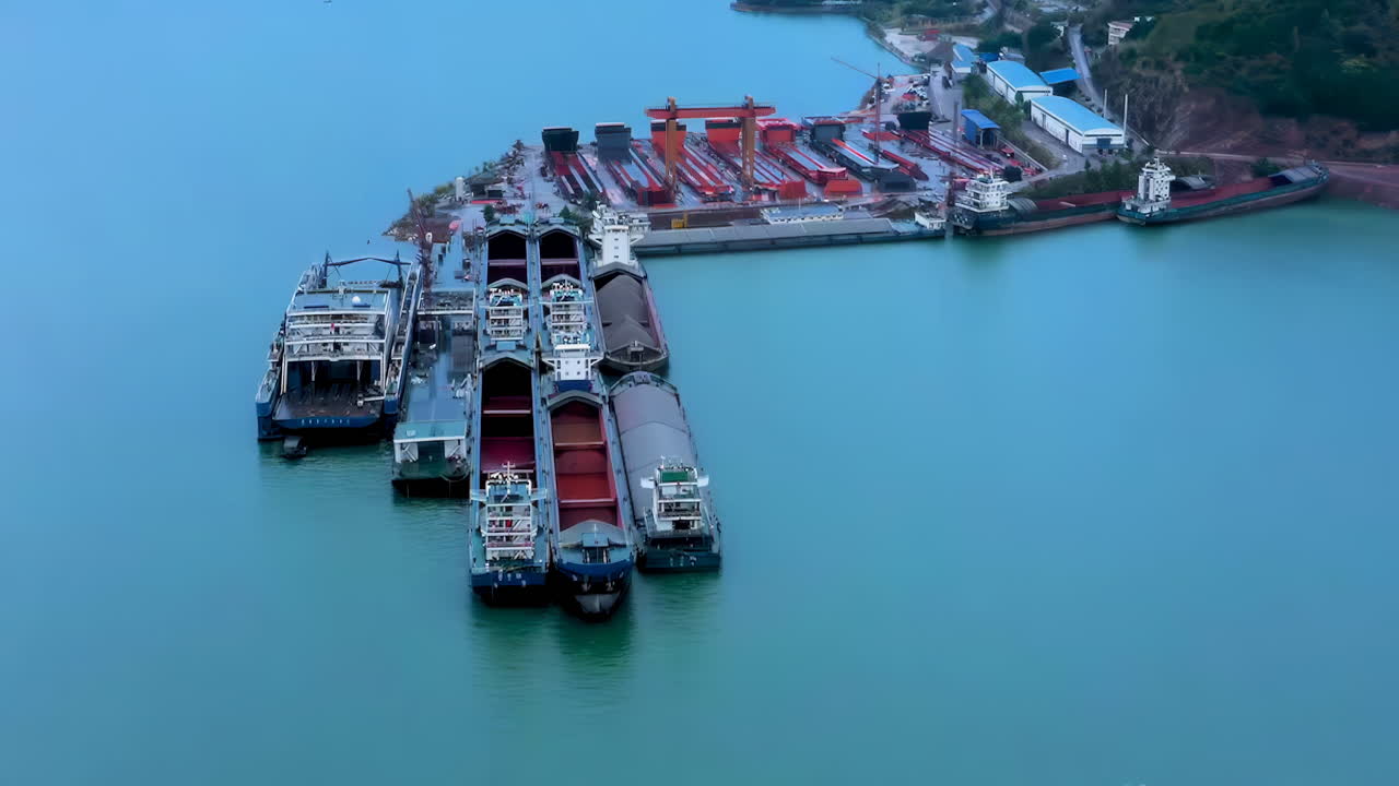 Industrial factory real shot of Shipbuilding and ship repair yard. Shipyard contains many cranes, dry docks, slipways, warehouses, painting facilities and large areas for fabrication of ships
