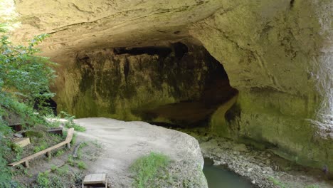 a tourist destination near vratsa in bulgaria, frequented for its historical significance and a speological site for its natural rock formations and subterranean streams in gods bridge cave