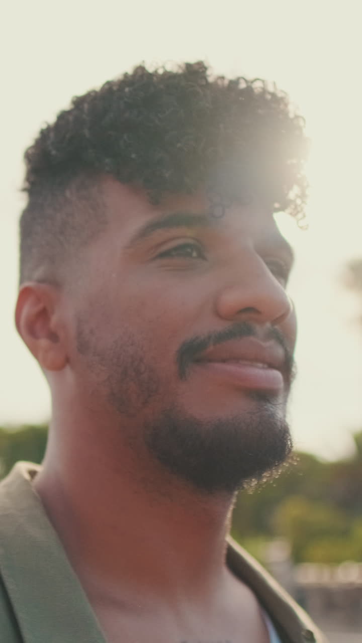 Portrait of a man with curly hair and beard