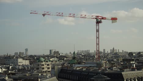 tower crane working construction repair in downtown of paris city action shot 4k 60p