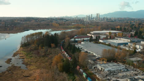 picturesque aerial view of burnaby lake and the greater vancouver skyline