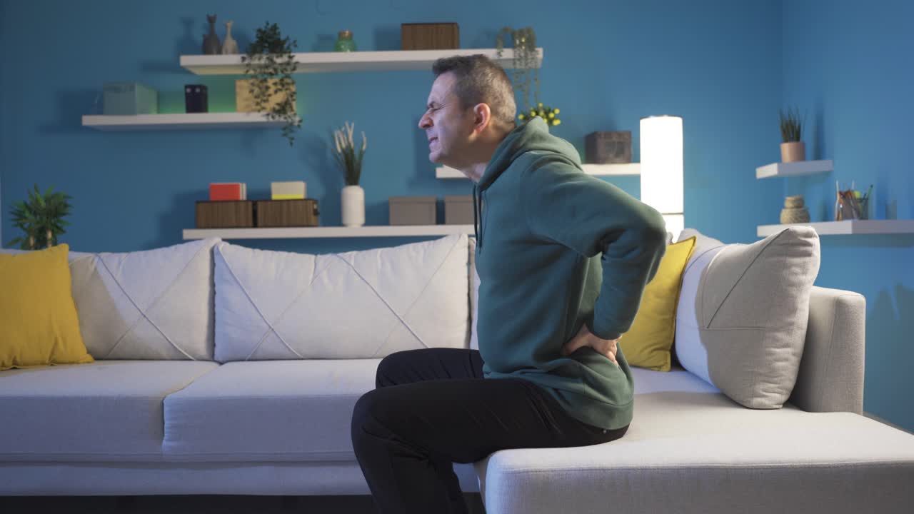 Man with severe back pain. Lumbar hernia.