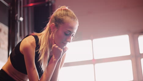 Slow-Motion-Of-Thoughtful-Attractive-Woman-In-Sportswear-Sitting-At-Fitness-Club