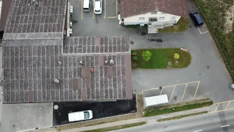 Rooftop-of-a-house-and-a-road,-top-view-by-a-mavic-drone