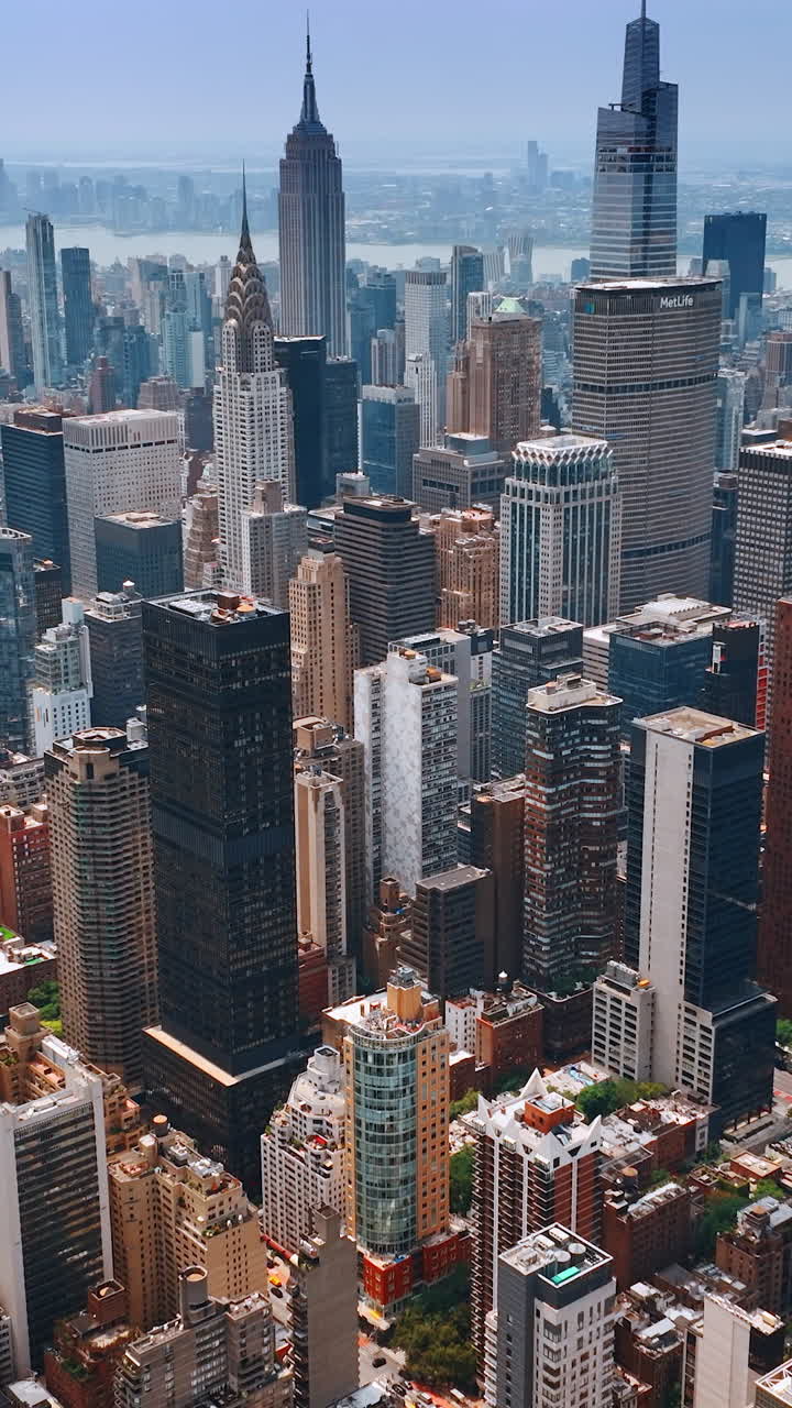 Dense diverse architecture of New York downtown. Wonderful skyscrapers from aerial perspective. Vertical video