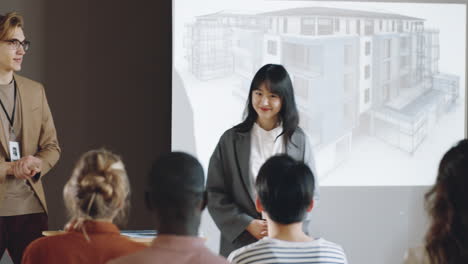 asian female architect presenting building project on conference