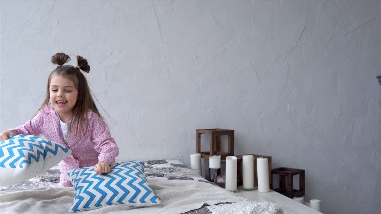Cute Little Girl Playing on Bed