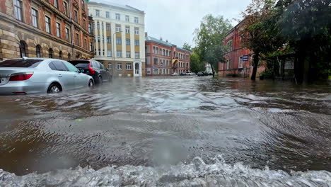 waterlogged streets due to heavy rain. waves created due to movement of vehicles.