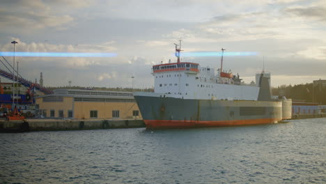 cargo ship at port during sunrise/sunset