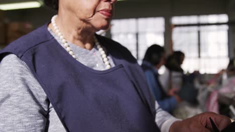 Mixed-race-woman-working-at-a-hat-factory