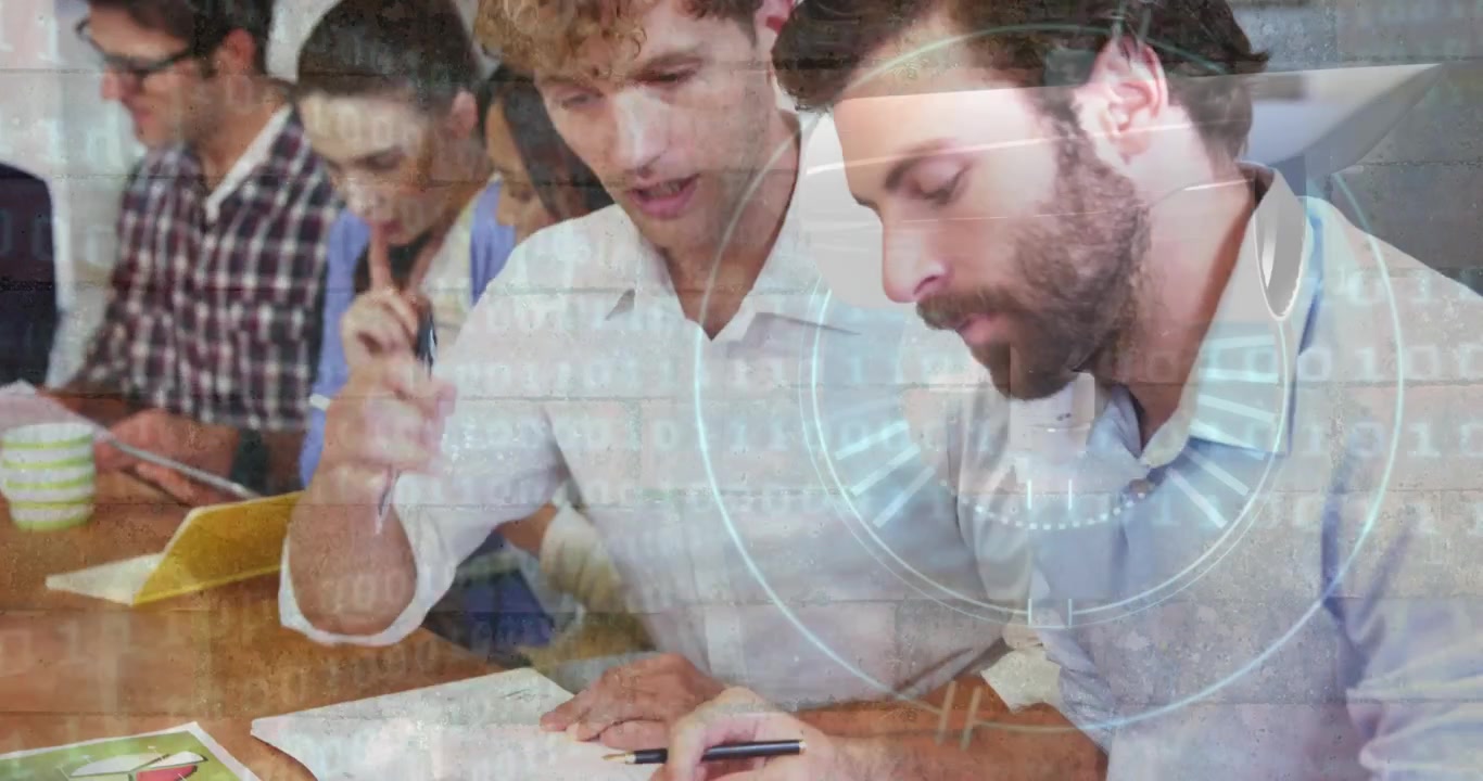 Round scanner and data processing against two caucasian men discussing at office
