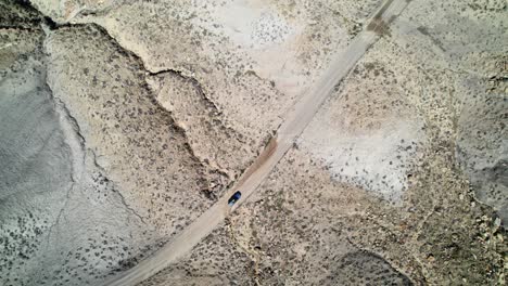 drone shot of a car moving toward cotton wood canyon road