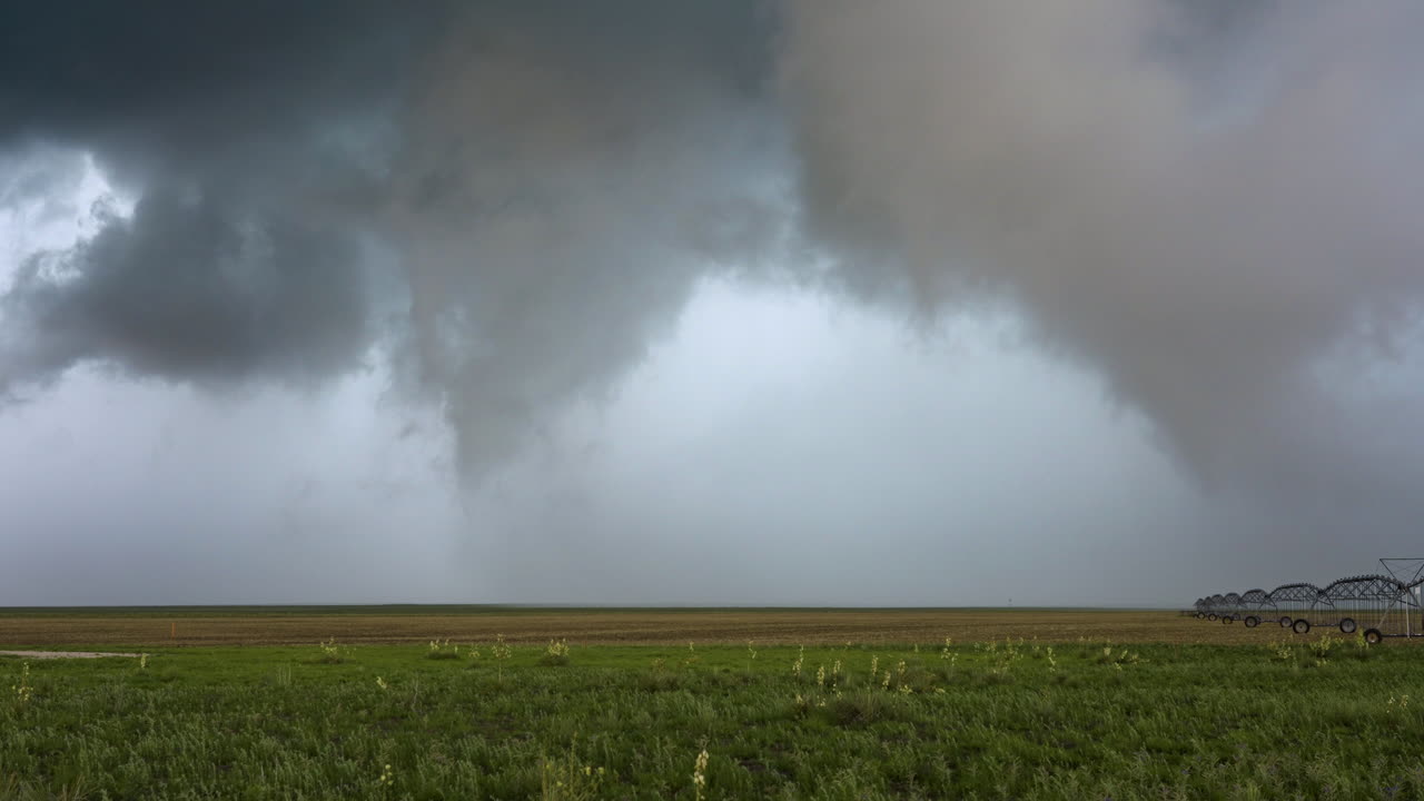 Rain Clouds Moving Over Agricultural Fields And Watering System