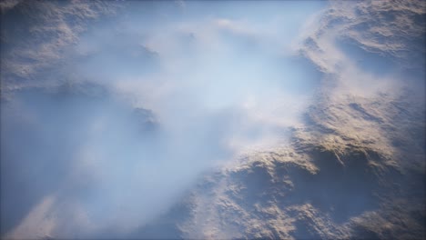 distant mountain range and thin layer of fog on the valleys