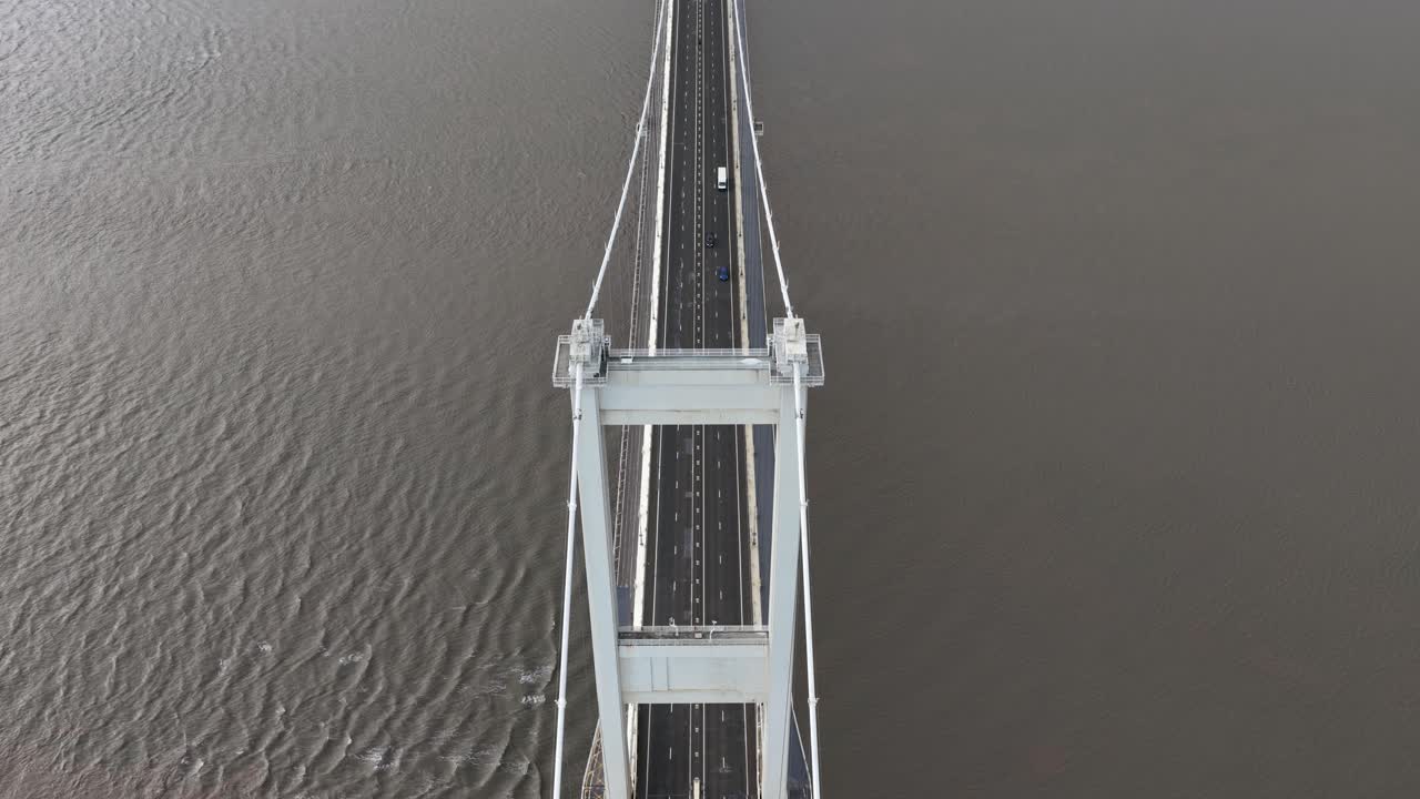 Aerial view of the Severn Bridge (Pont Hafren), the historic motorway suspension bridge connecting England and Wales, showcasing its engineering design, river crossing, and transport significance