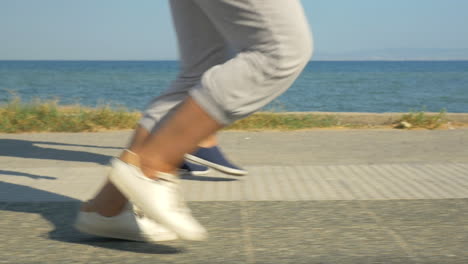 legs of two running people