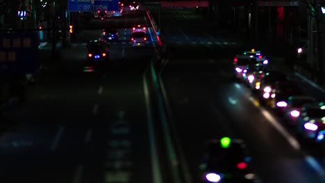 a night timelapse of the miniature traffic jam at the city street in tokyo