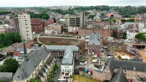hertogensite leuven - aerial orbit of construction site in belgium