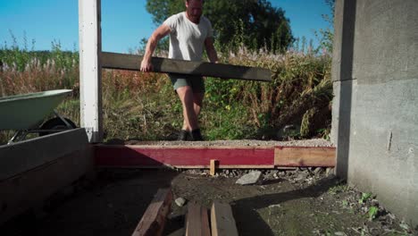 a man is in the process of building a greenhouse in indre fosen, norway - close up