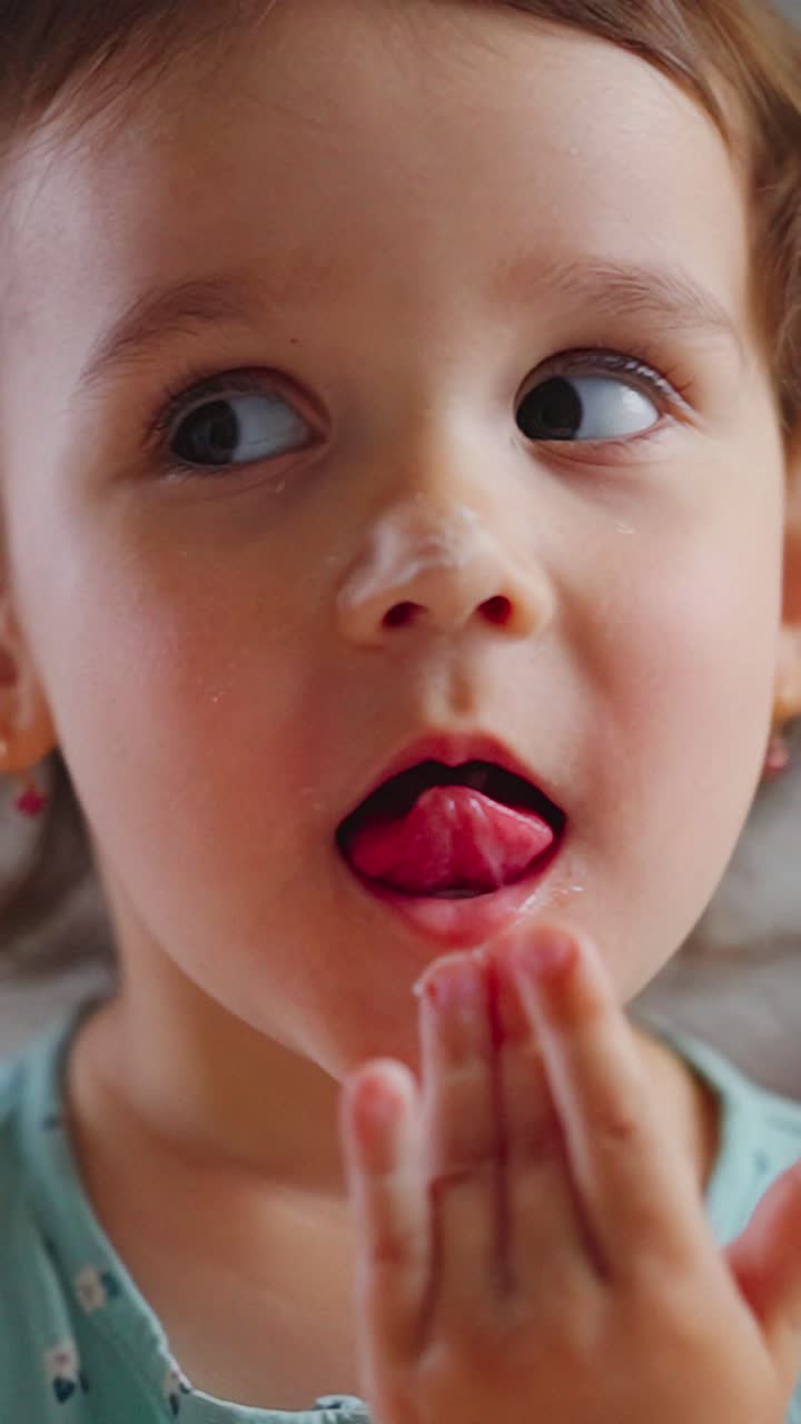 A Young Child's Expression of Curiosity and Discovery as They Examine Something Intriguing in Their Hands, Capturing Innocence and Wonder in Everyday Moments