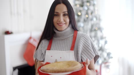attractive young woman baking tarts for xmas
