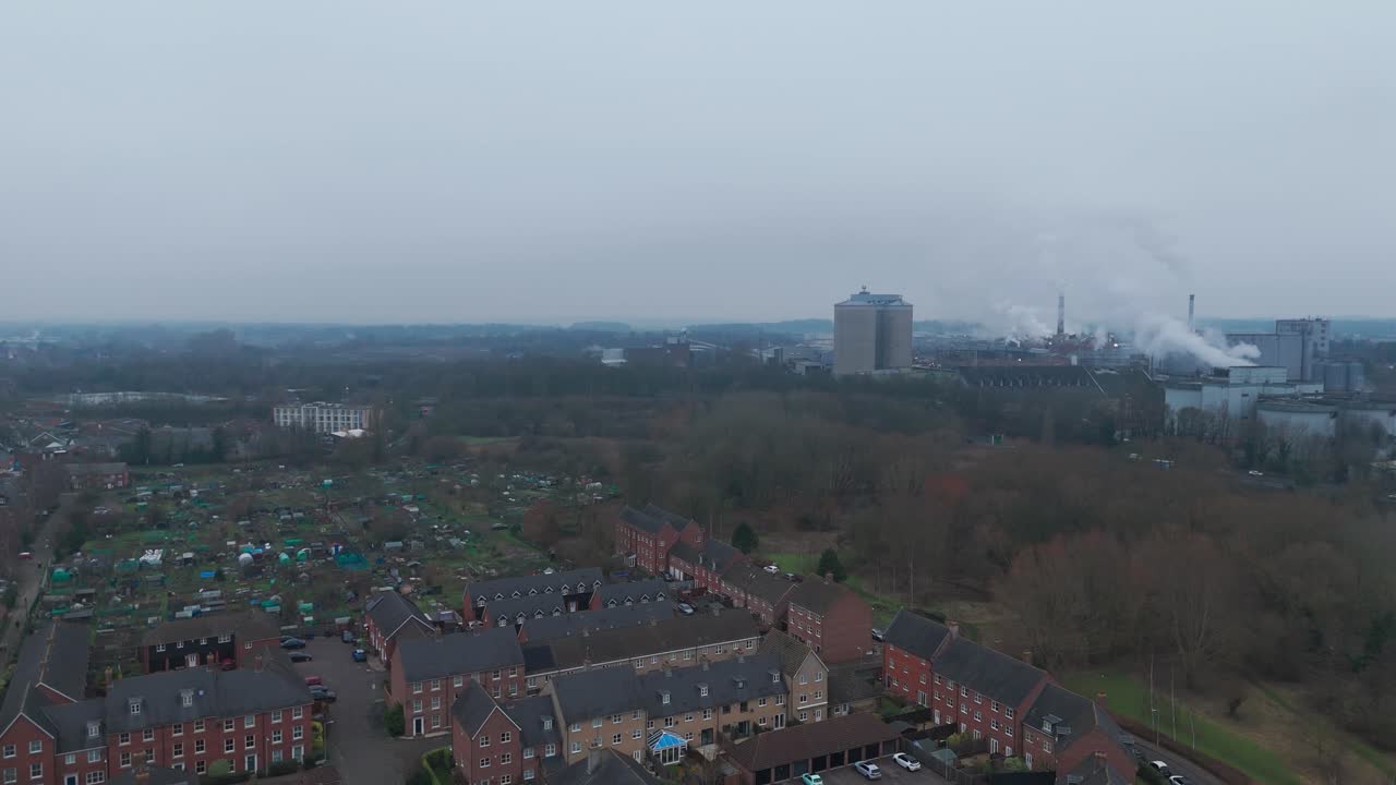 Bury st edmunds, featuring residential areas and distant industrial buildings, aerial view