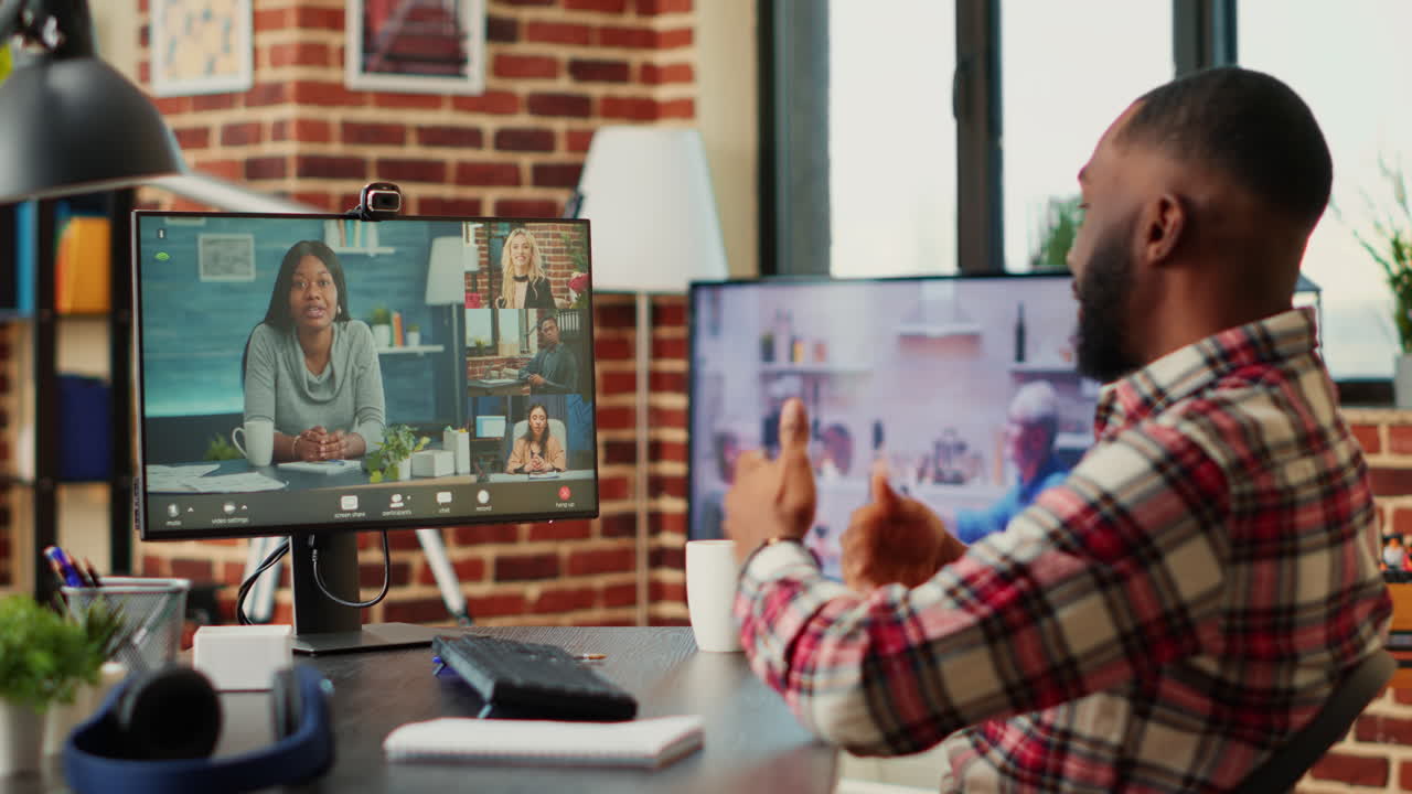 Man Attending a Virtual Meeting from His Home Office