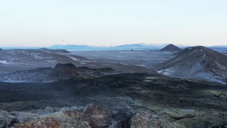 Extreme-wild-uninhabited-volcanic-landscape-with-dormant-volcano,-aerial