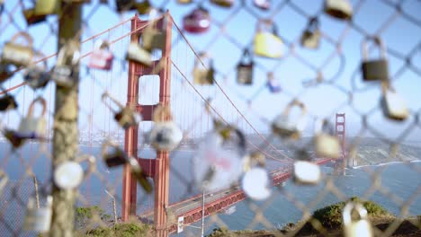 Rush-hour-passing-by-the-Golden-Gate-Bridge-and-a-wire-fence-with-a-variant-of-locks