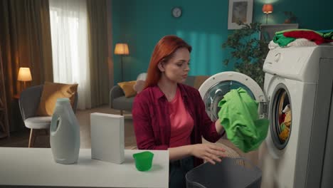 woman doing laundry and finding a stain