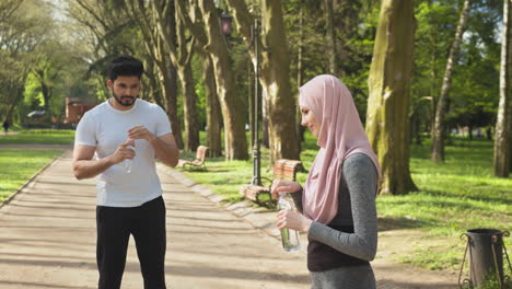 couple exercising in a park